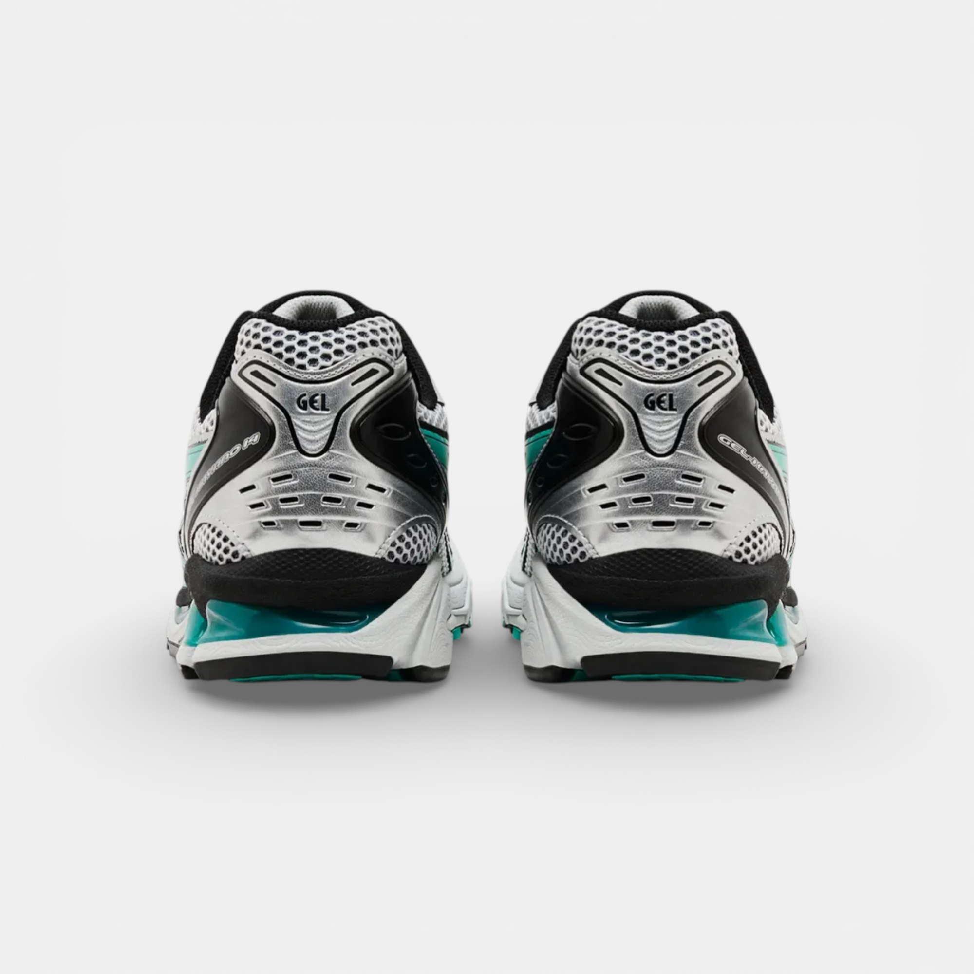 ASICS Gel-Kayano 14 Tiffany sneakers in silver, black, and teal. Mesh and synthetic materials with GEL cushioning.