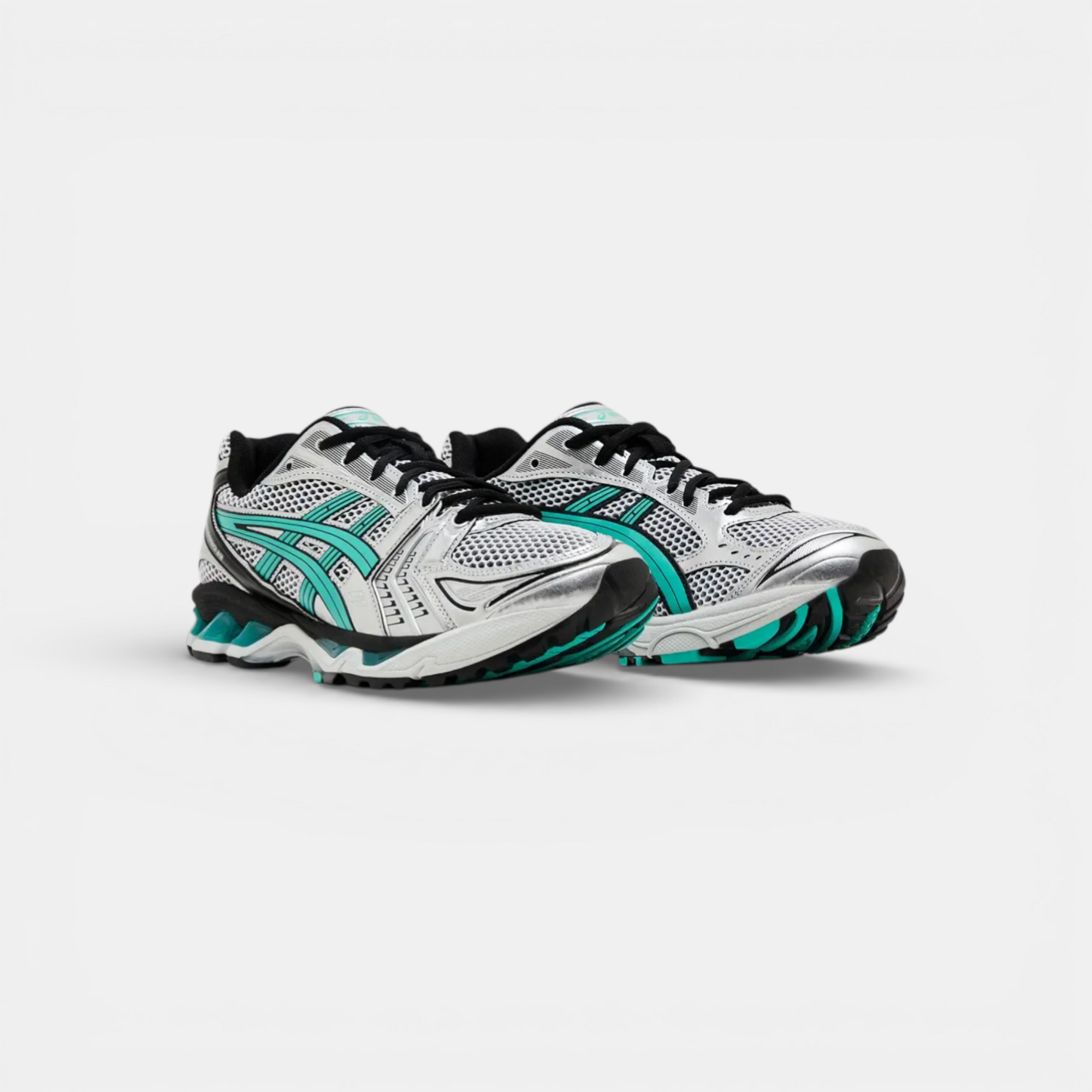 ASICS Gel-Kayano 14 Tiffany sneakers in silver, white, black, and teal. Mesh and synthetic upper with signature stripes.